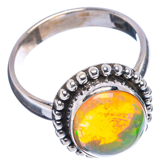 Sterling silver opal ring with oval cabochon in beaded bezel on band