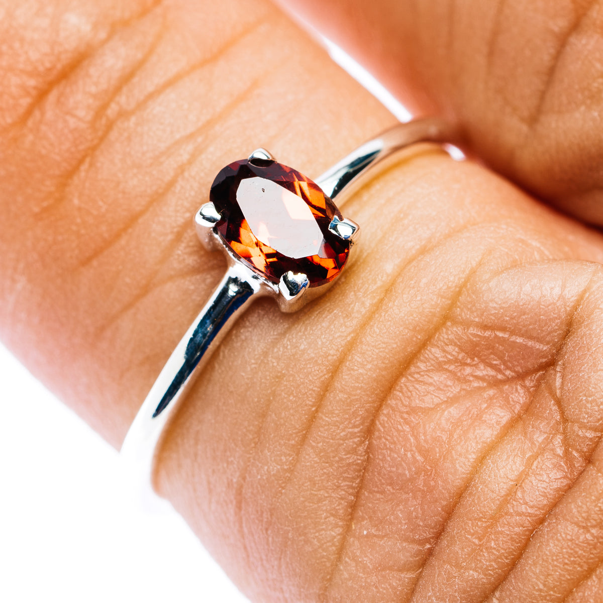 Garnet stackable sterling silver ring with oval dark red stone, open split shank