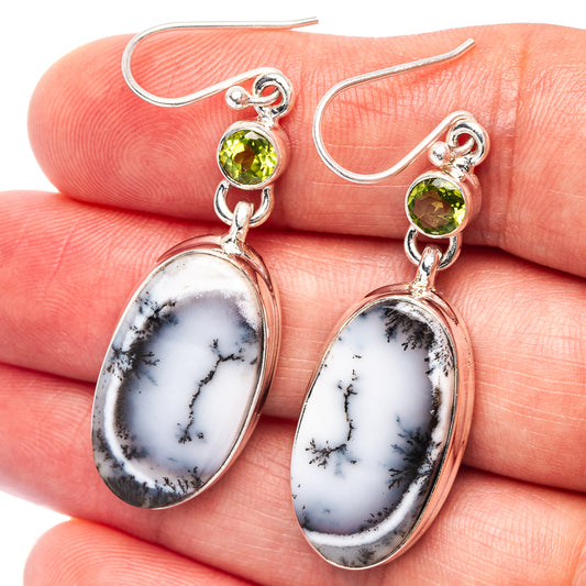 Sterling silver drop earrings with green peridot and oval white dendritic opal