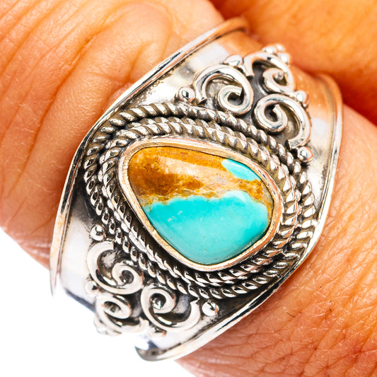 Sterling silver turquoise ring with oval blue stone and engraved rope-style setting