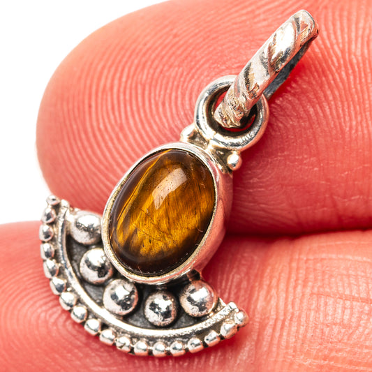 Dainty tiger's eye pendant with oval amber stone in .925 sterling silver setting