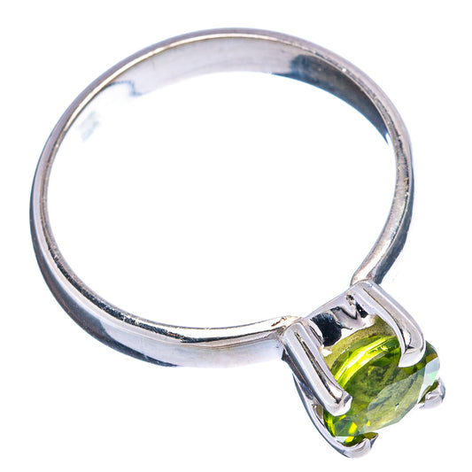 Sterling silver ring with oval faceted peridot green gemstone and prong bezel