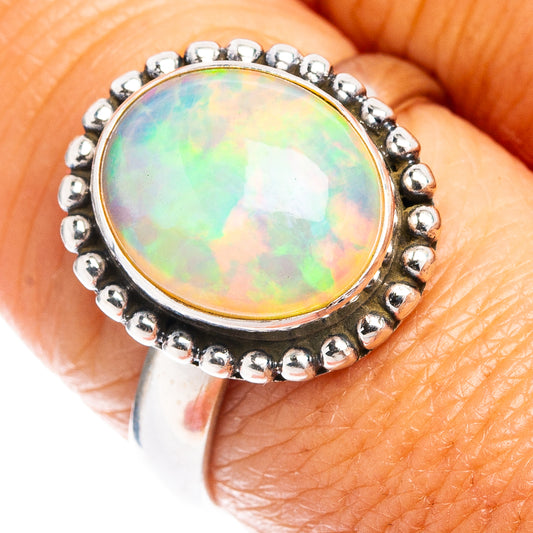 Round Ethiopian opal ring in .925 sterling silver with beaded bezel, rainbow iridescence