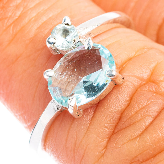 Sterling silver dainty ring with three light blue topaz stones, prong set