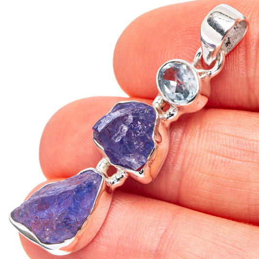 Sterling silver pendant detail: round blue topaz and two faceted tanzanite stones