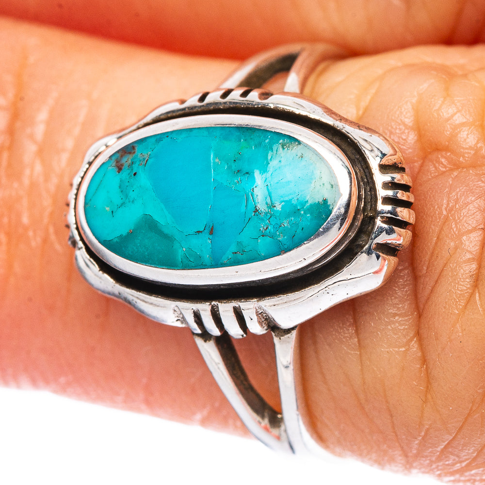 Turquoise oval cabochon silver ring close-up with engraved bezel and shank