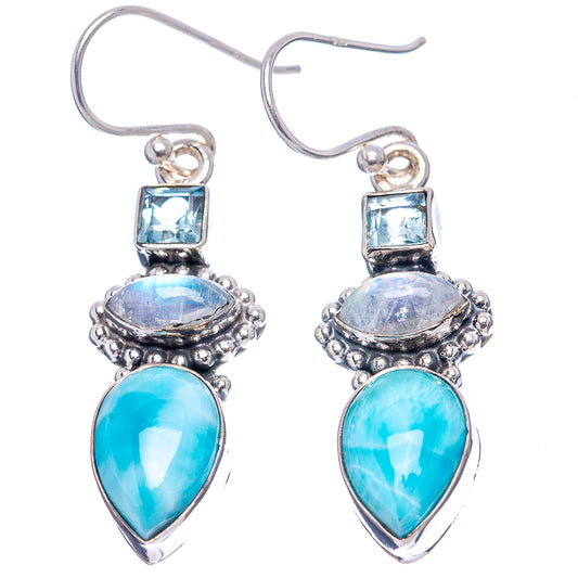 Sterling silver drop earrings featuring larimar teardrops, rainbow moonstone ovals, and blue topaz