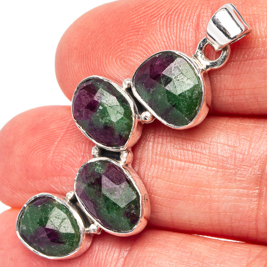 Oval gemstone pendant with purple and green stones in sterling silver settings