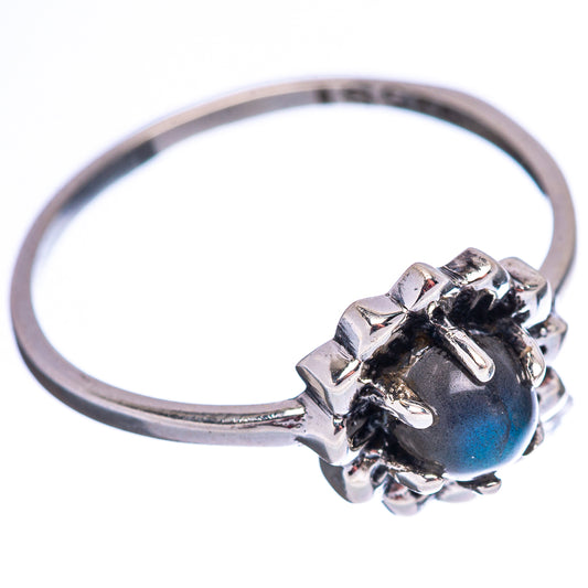 Sterling silver ring featuring blue labradorite stone in decorative bezel