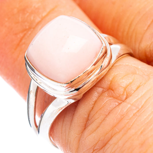 Sterling silver ring with pink oval opal cabochon, open bezel and polished band