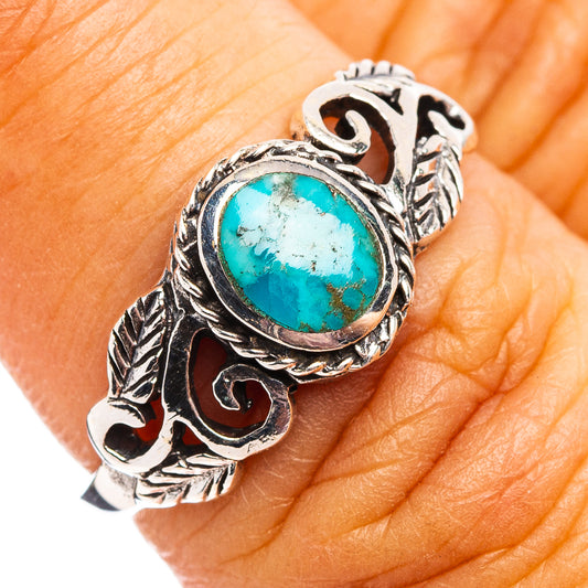 Turquoise cabochon sterling silver ring with ornate leaf and rope design