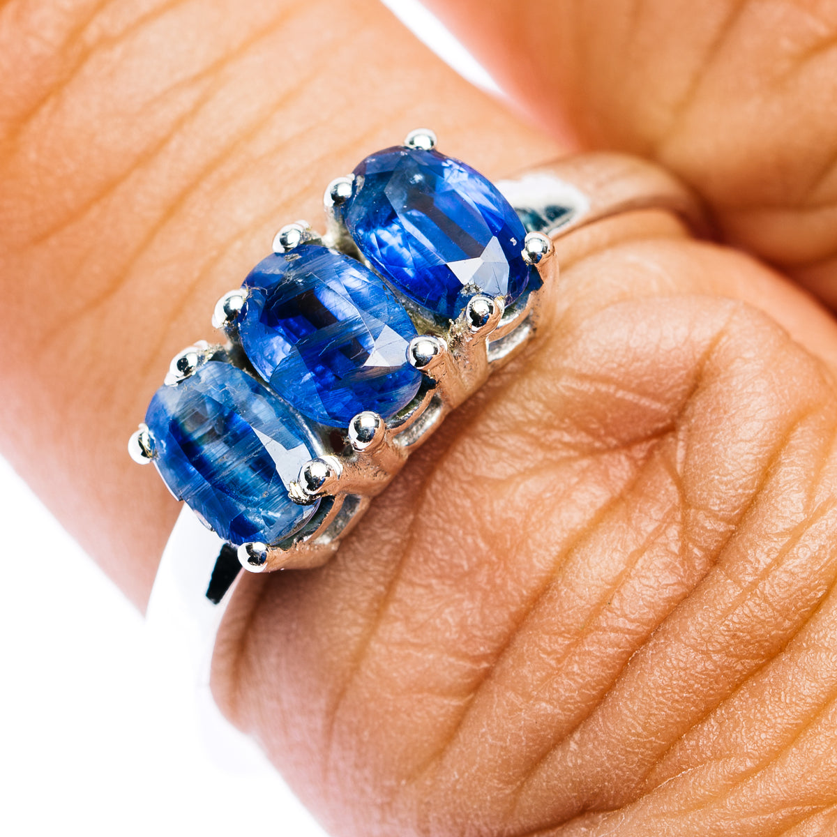 Sterling silver three-stone kyanite ring with three oval blue gemstones