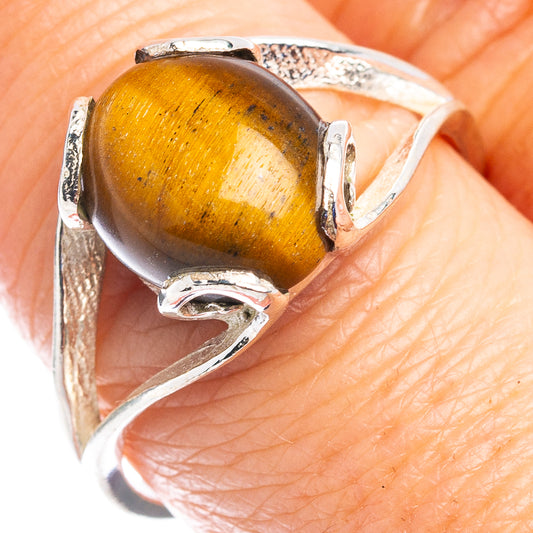 Sterling silver ring with oval tiger's-eye cabochon set in claw prongs