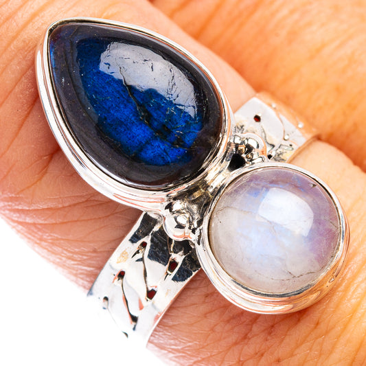 Sterling silver ring with oval blue labradorite and pale rainbow moonstone, side setting