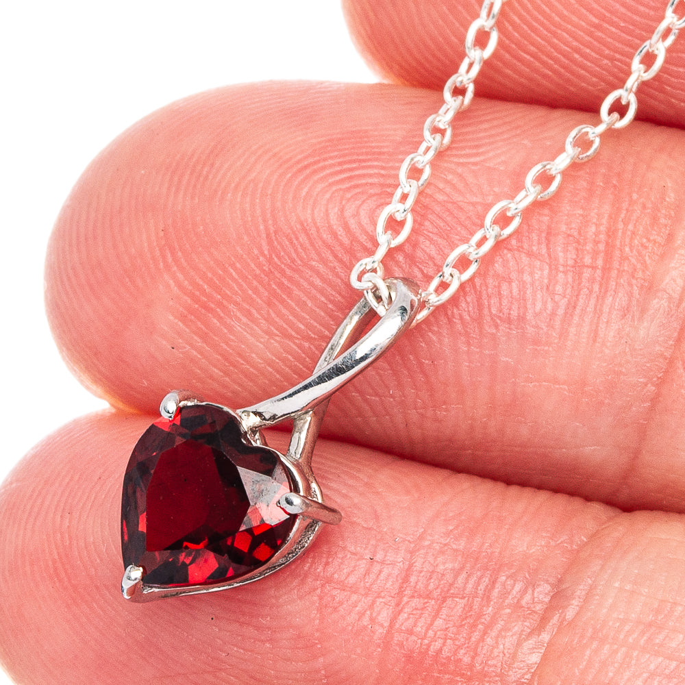 925 sterling silver heart pendant with red garnet stones in a silver prong setting