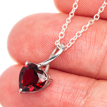 925 sterling silver heart pendant with red garnet stones in a silver prong setting