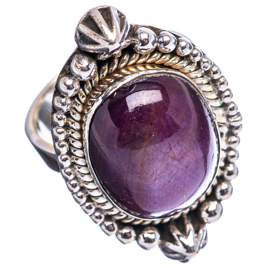Sterling silver ring with oval purple gemstone and raised bead detailing