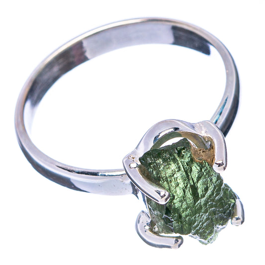 Sterling silver moldavite ring with faceted green rough stone in claw prongs