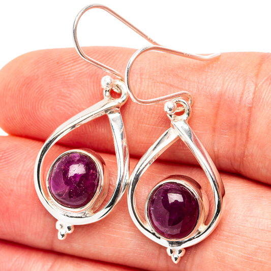 Sterling silver teardrop earrings with purple ruby cabochons