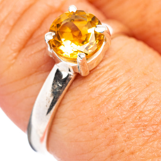Sterling silver citrine ring with round yellow gemstone and four-prong setting