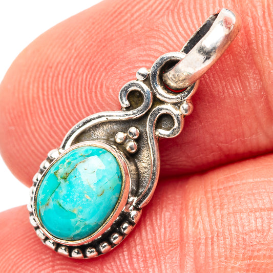 Turquoise pendant with oval cabochon in .925 sterling silver teardrop setting