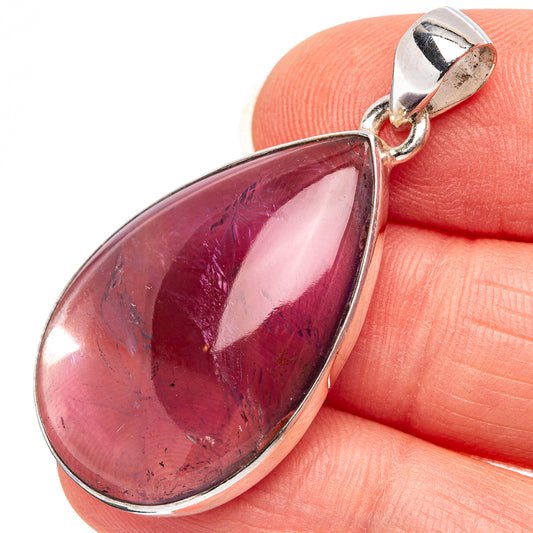 Amethyst teardrop pendant in .925 sterling silver with red-purple cabochon stone