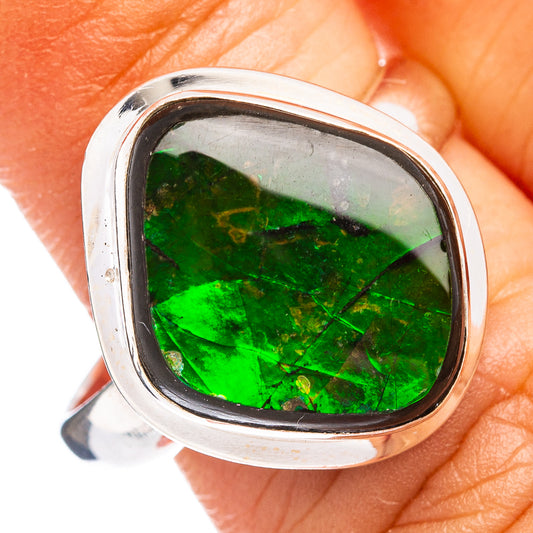 Sterling silver ring with oval green ammolite gemstone in bezel setting