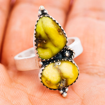Sterling silver adjustable ring with oval yellow gemstone cabochon and split-top band