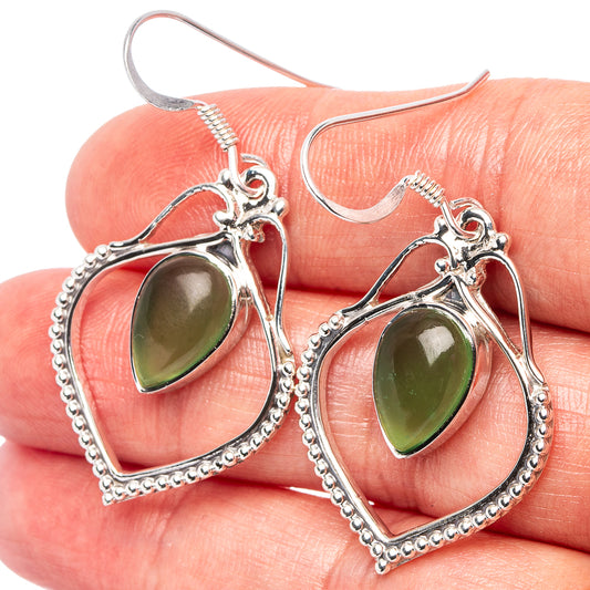 Sterling silver jade earrings with heart-shaped setting and teardrop green stones