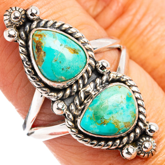 Sterling silver turquoise ring with two oval settings and carved rope-style border