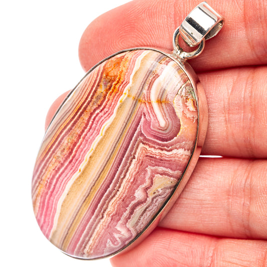 Rhodochrosite oval pendant in .925 sterling silver with striped pink, white, and gold stone