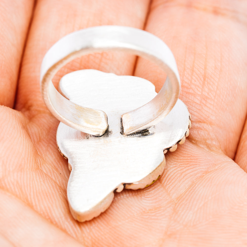 Sterling silver adjustable ring band with open back and heart-shaped stone setting