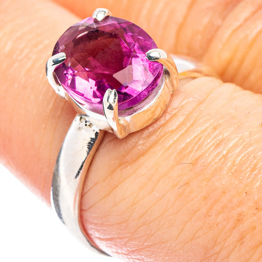 Sterling silver ring with faceted pink-purple fluorite oval center and prong setting