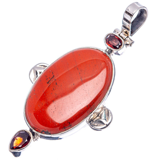 Oval red jasper cabochon pendant with two dark garnet accents in .925 sterling silver