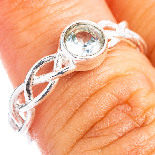 Sterling silver dainty ring with round blue topaz gemstone on openwork band
