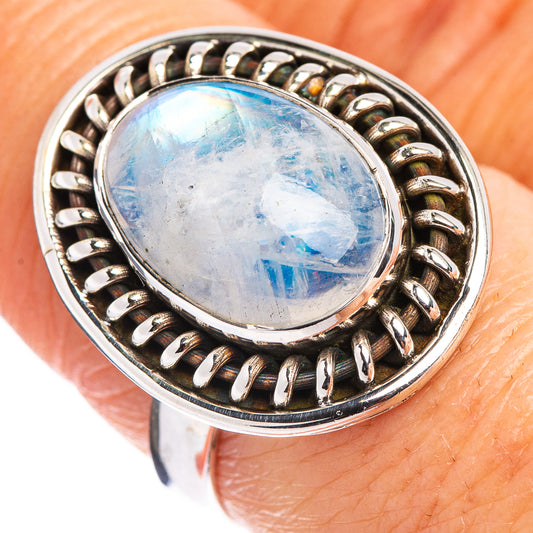 Sterling silver oval moonstone ring, blue flash cabochon in round beaded bezel