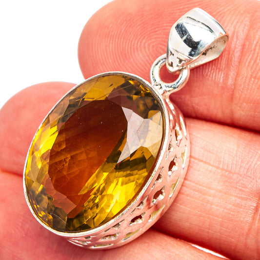 Oval faceted citrine pendant in .925 sterling silver bezel with bail