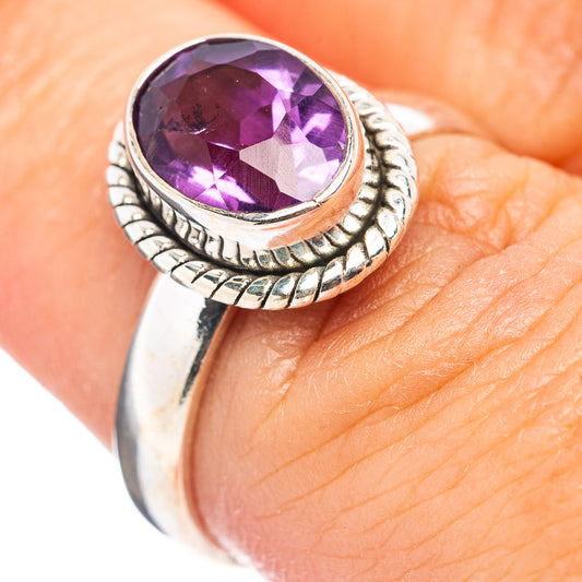 Sterling silver amethyst ring with oval purple gemstone and braided bezel
