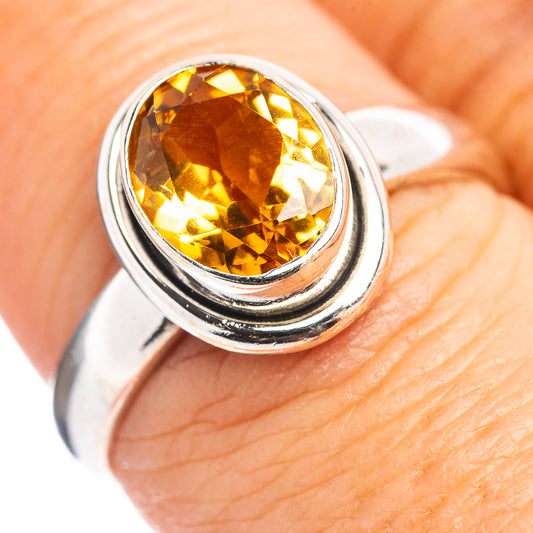 Sterling silver ring with oval citrine gemstone, close-up view