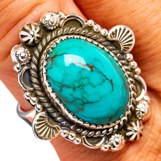 Turquoise oval sterling silver ring with ornate bezel and rope edges, adjustable band