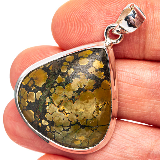 Sterling silver teardrop pendant with yellow and black stone cabochon bail