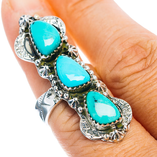 Southwestern turquoise teardrop ring with three blue stones and ornate silver setting