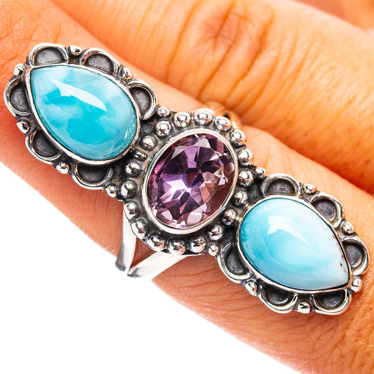 925 sterling silver ring with three oval stones: two blue larimar and one purple amethyst.