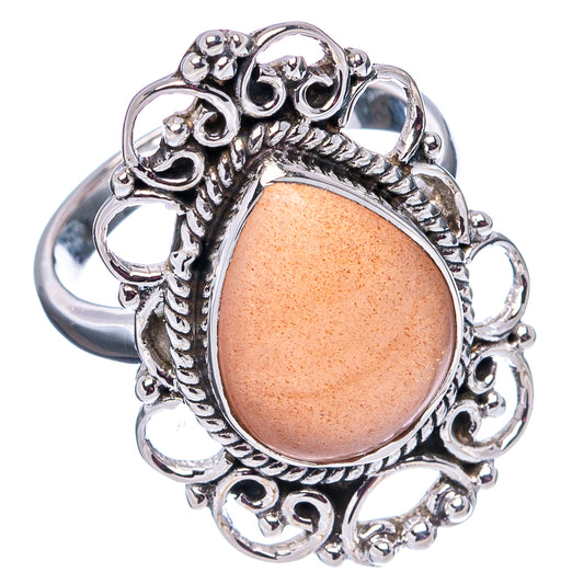 Sterling silver oval peach cabochon ring with scalloped edge detail
