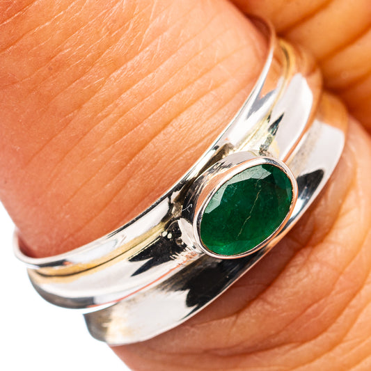 Oval green gemstone sterling silver spinner ring with polished openwork band