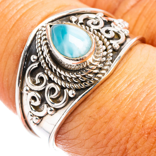 Sterling silver ring with oval blue larimar cabochon and detailed filigree setting