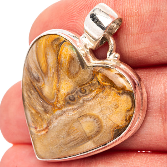 Heart-shaped jasper pendant with sterling silver bail, mounted on gemstone face.