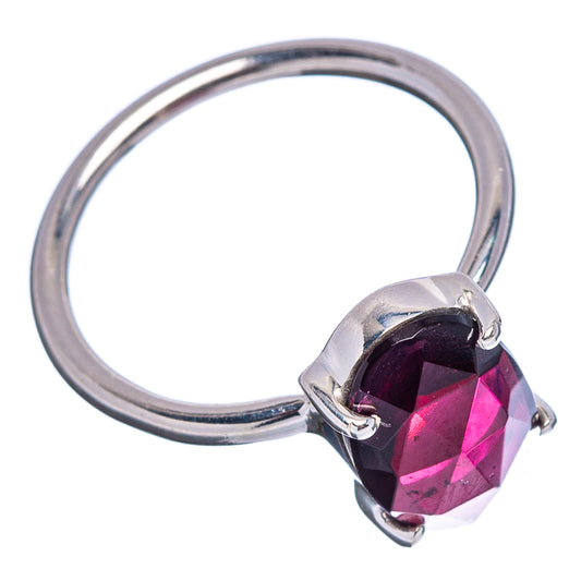 Faceted garnet ring in .925 sterling silver, dark red gem set in three-prong mount