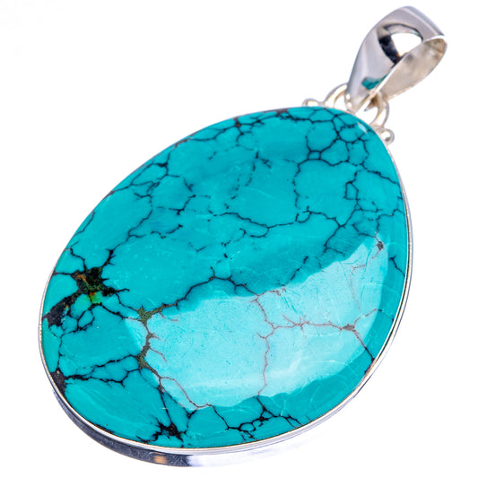 Turquoise oval pendant with silver bail and bezel, veined stone with lighter patches