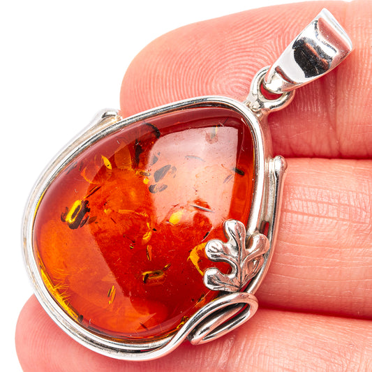 Amber leaf teardrop pendant with oval amber stone in .925 sterling silver frame